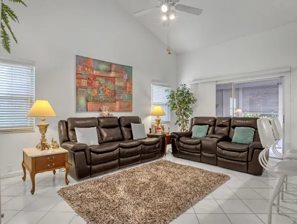 a view of a livingroom with furniture and a window
