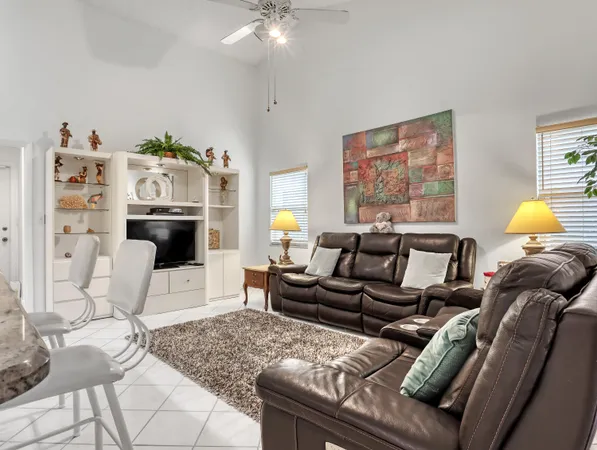 a dining room with furniture and chandelier