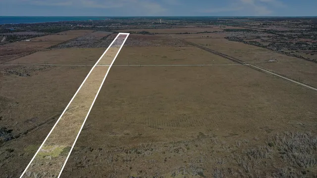 a view of an empty space and ocean view