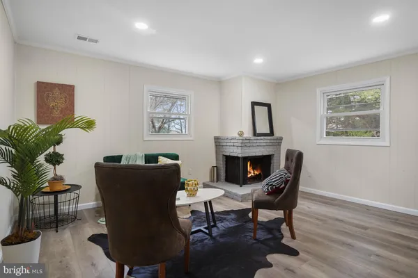 a view of a livingroom with furniture and a fireplace