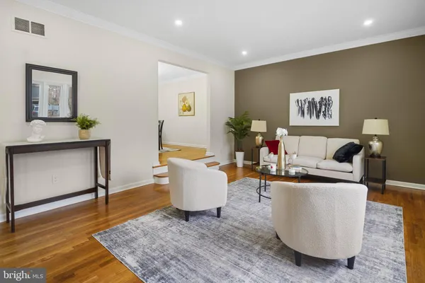 a living room with furniture and a rug