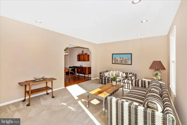 a bedroom with furniture and a wooden floor