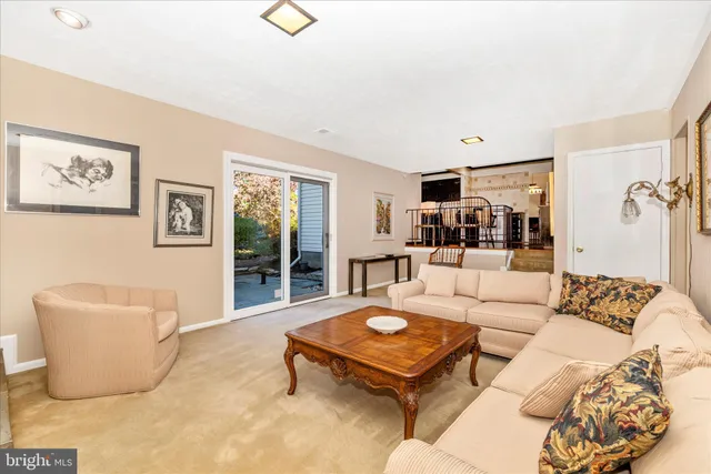 a living room with furniture and a table