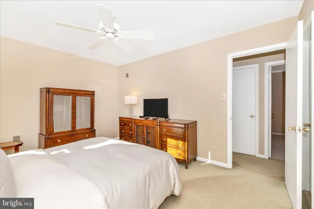 a bed room with a bed and a chandelier