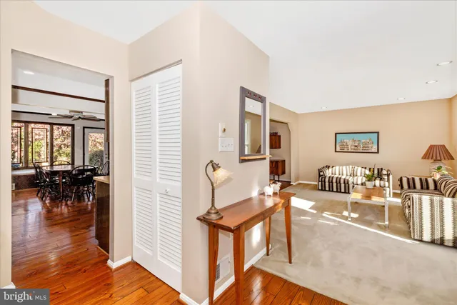 a living room with furniture a dining table and chairs