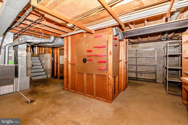 a front view of a building with a garden