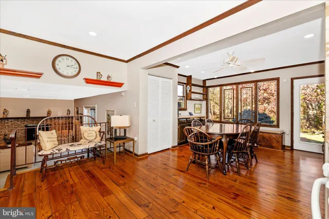 a view of a dining room with furniture wooden floor and chandelier