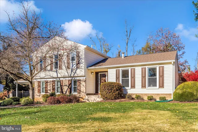 a swimming pool with outdoor seating and yard
