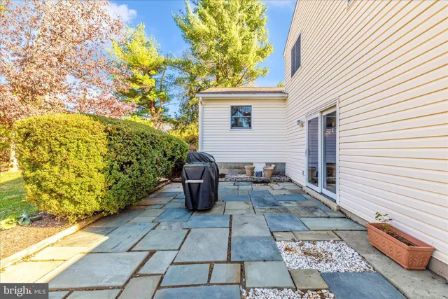 a view of a swimming pool with an outdoor seating and a yard