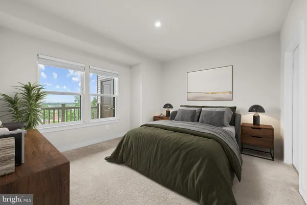 a bedroom with a bed and a couch