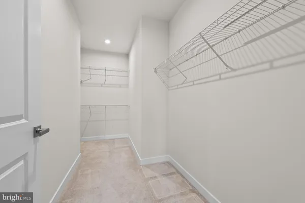 a bathroom with a double vanity sink mirror double shower and a toilet