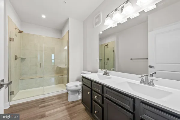 a bathroom with a glass shower door
