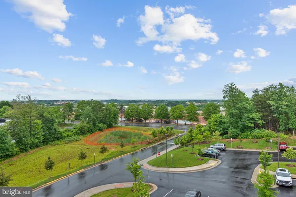a view of a swimming pool with a yard
