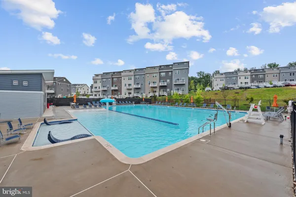 an aerial view of a house with a swimming pool