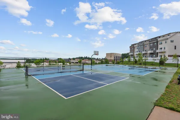 a view of a house with a big yard and potted plants