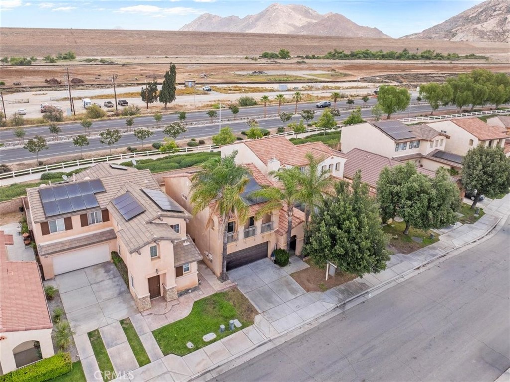 1474 Albillo Loop Perris, CA 92571 - Photo 32 of 35 an aerial view of residential houses with outdoor space and river