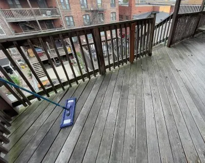 a balcony with wooden floor