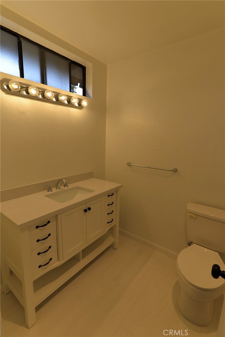 103 El Oriente, Unit 4 San Clemente, CA 92672 - Photo 11 of 19 a bathroom with a sink and a toilet
