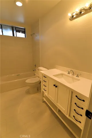 a view of a bathroom with sink dryer and washer