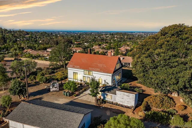 an aerial view of a house with a garden