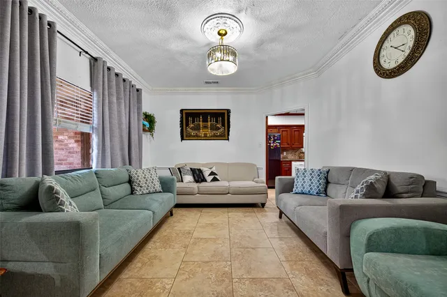 a view of a dining room with furniture and window