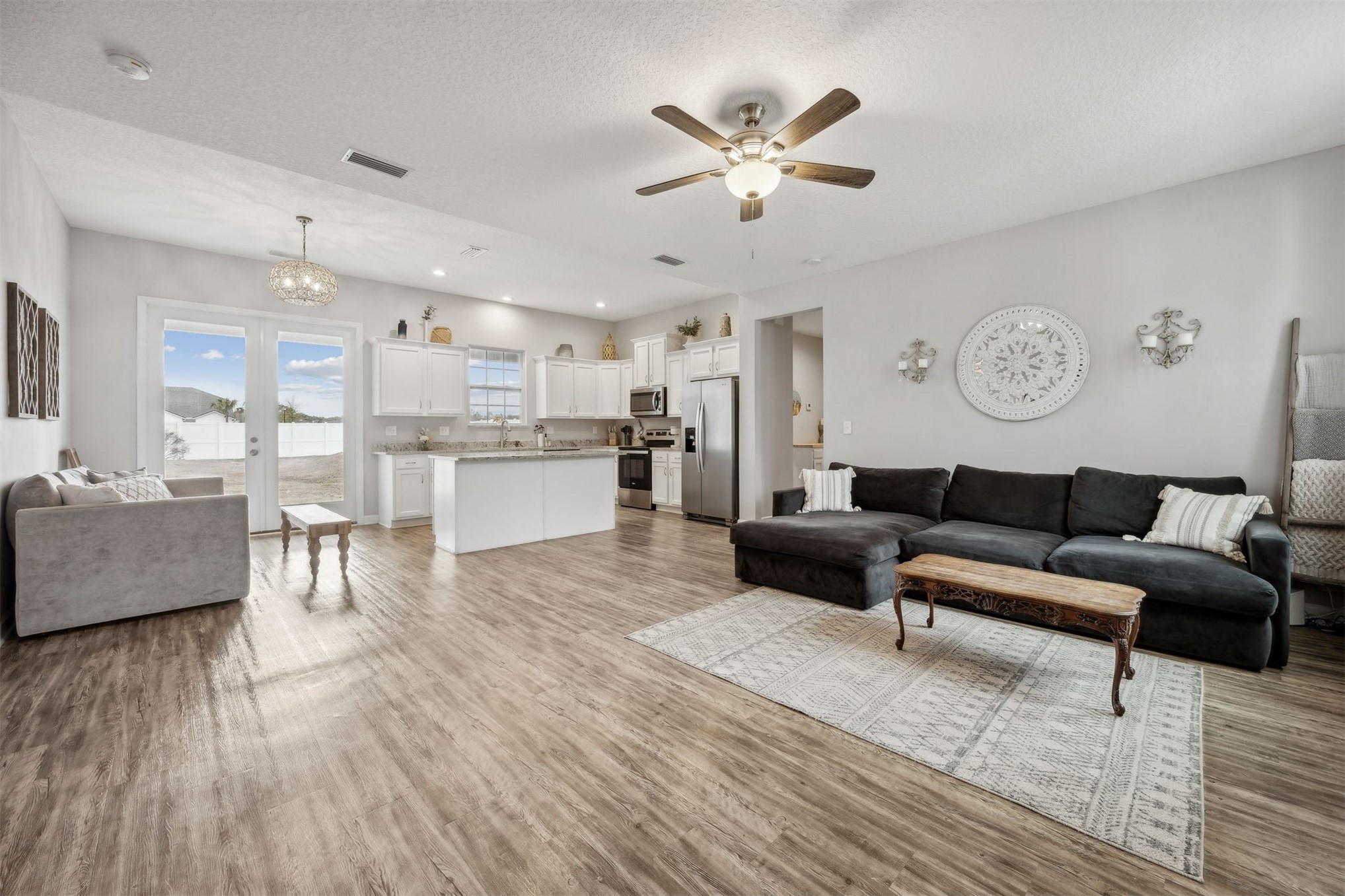 96718 Blackrock Road Yulee, FL 32097 - Photo 19 of 54 a living room with furniture and a wooden floor