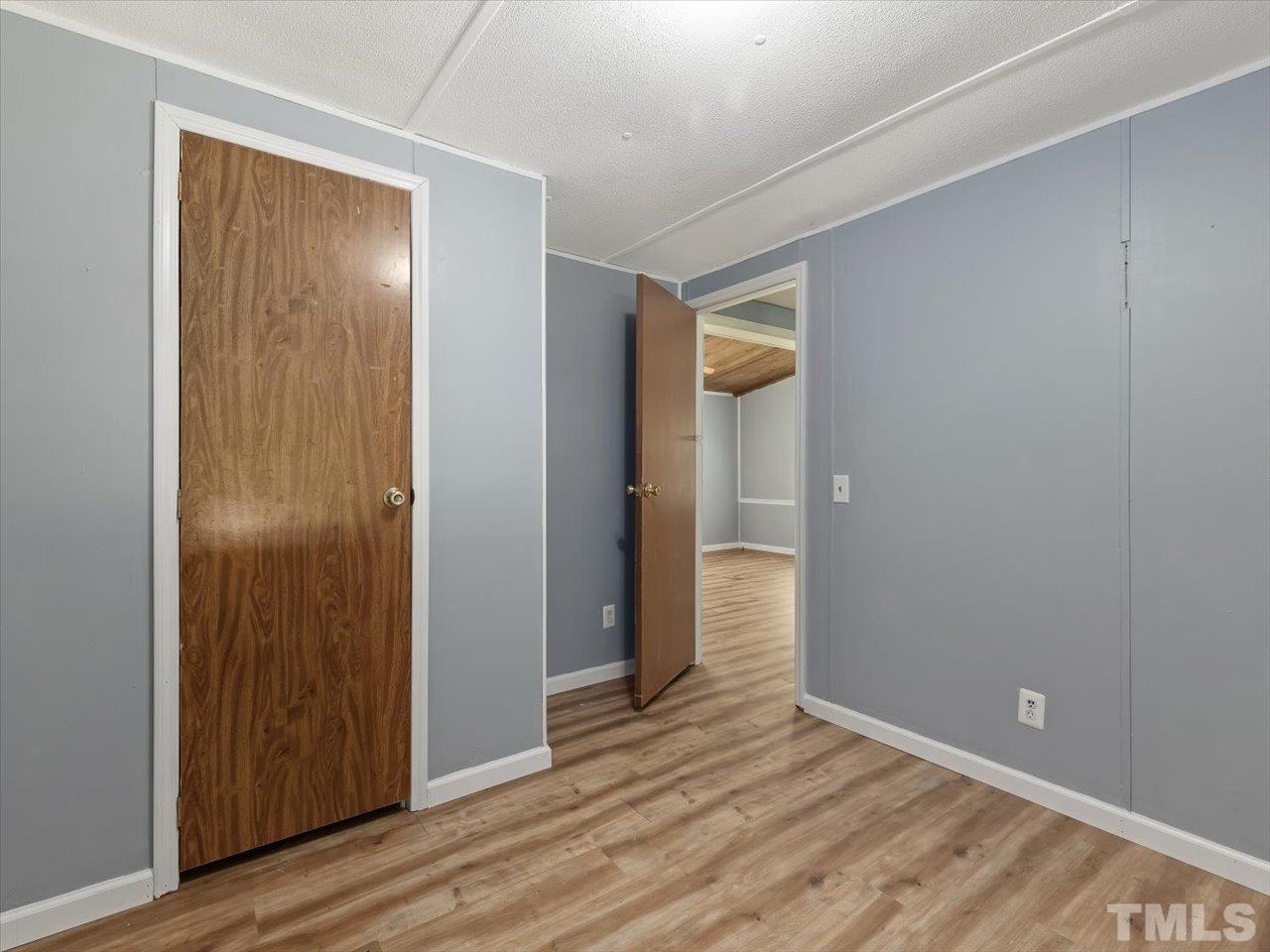 719 Russell Loop Road Prospect Hill, NC 27314 - Photo 21 of 30 Complete with Walk-in closet and sunny window ~ easy access to full bath.