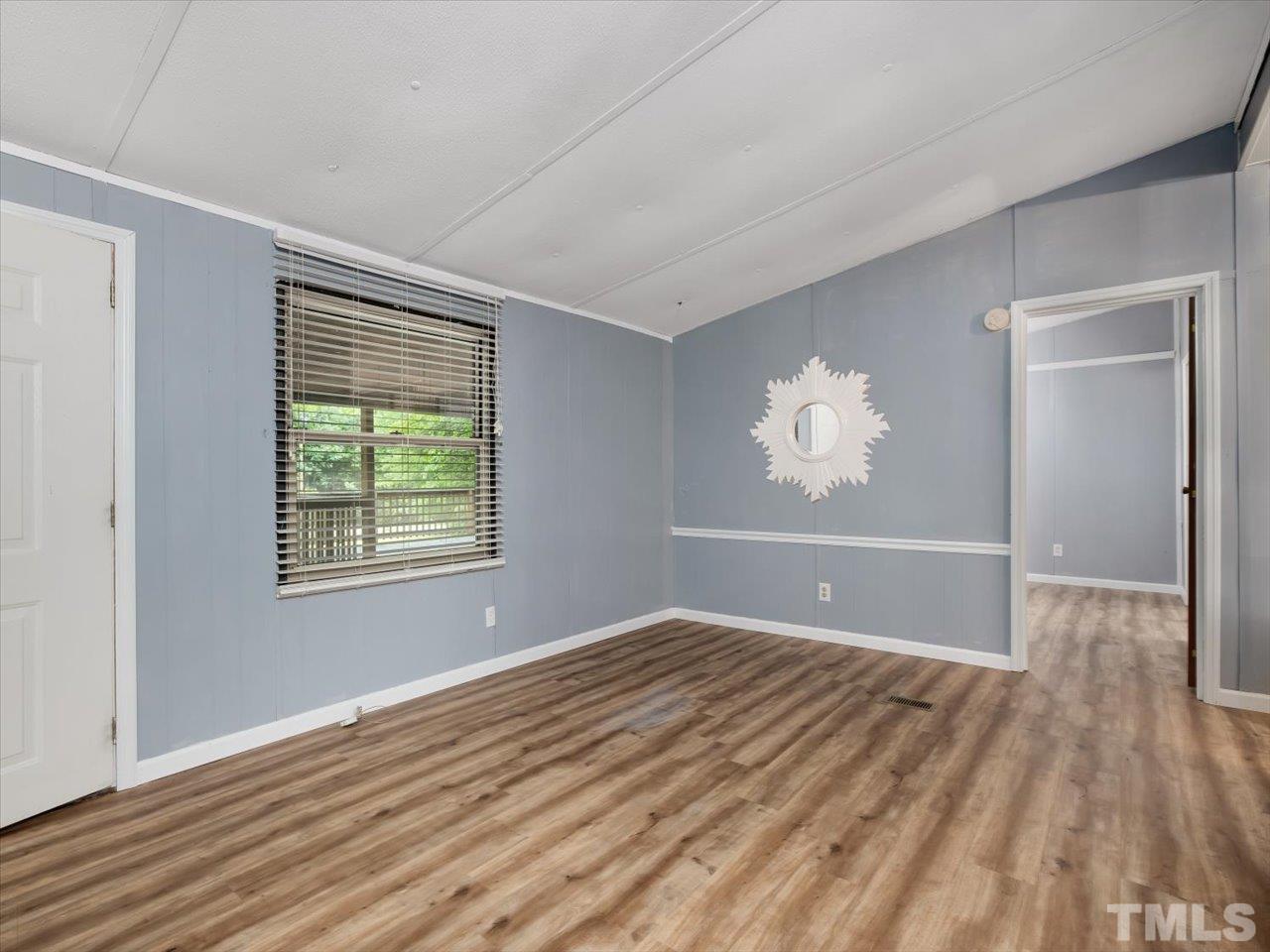 719 Russell Loop Road Prospect Hill, NC 27314 - Photo 8 of 30 Notice FRESH paint & NEW luxury vinyl plank flooring - durable quality Commercial grade throughout!