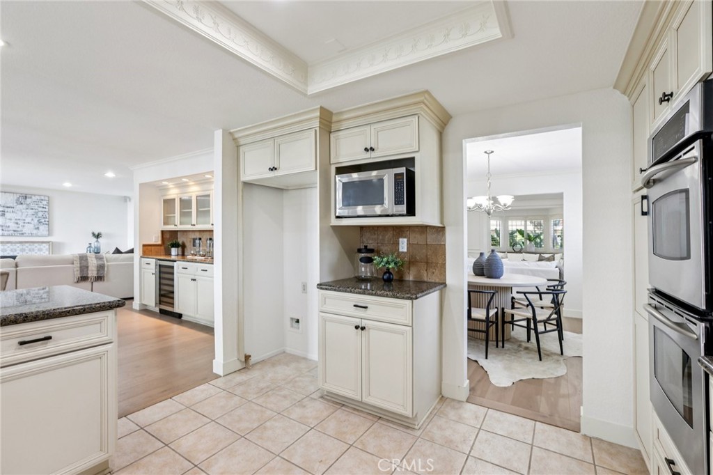 2001 Bataan Road Redondo Beach, CA 90278 - Photo 14 of 56 a kitchen with white cabinets and appliances