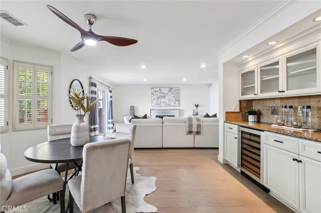 2001 Bataan Road Redondo Beach, CA 90278 - Photo 18 of 56 a living room with furniture a dining table and chairs