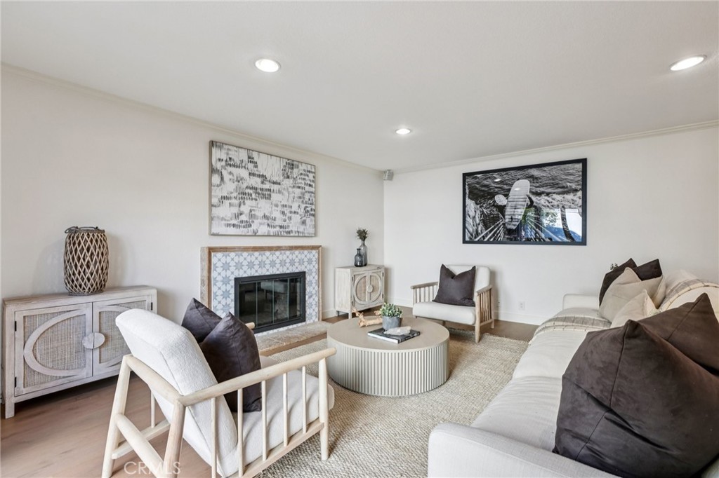 2001 Bataan Road Redondo Beach, CA 90278 - Photo 20 of 56 a living room with furniture a rug and a fireplace