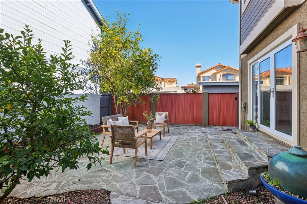 2001 Bataan Road Redondo Beach, CA 90278 - Photo 28 of 56 a view of a patio with table and chairs and potted plants