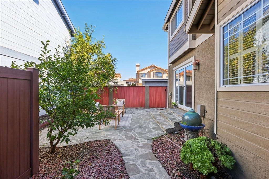 2001 Bataan Road Redondo Beach, CA 90278 - Photo 29 of 56 a view of a house with a yard and potted plants