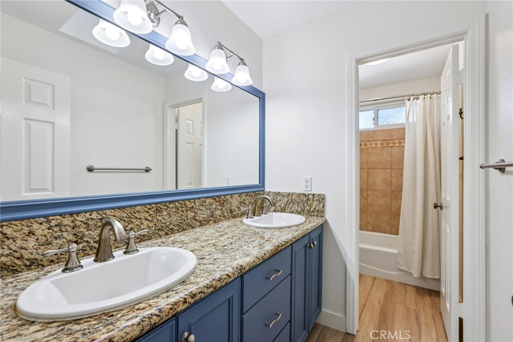 2001 Bataan Road Redondo Beach, CA 90278 - Photo 43 of 56 a bathroom with a granite countertop sink and a mirror