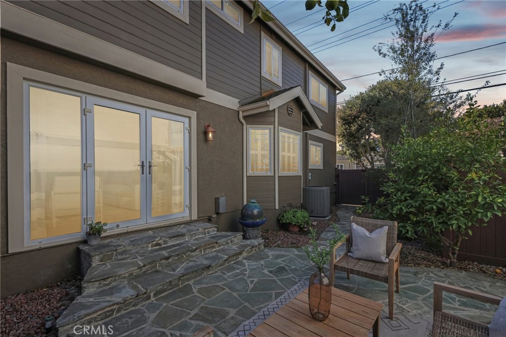 2001 Bataan Road Redondo Beach, CA 90278 - Photo 54 of 56 a view of a patio with table and chairs potted plants and floor to ceiling window