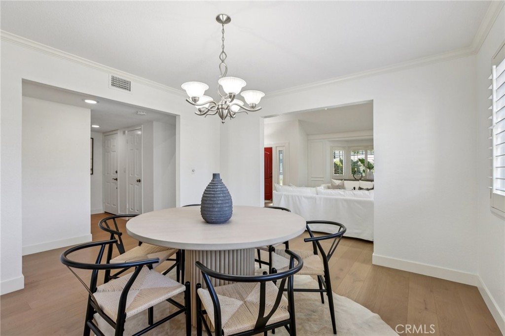 2001 Bataan Road Redondo Beach, CA 90278 - Photo 8 of 56 a view of a dining room with furniture and wooden floor