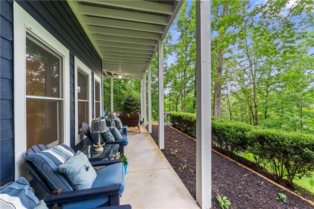 320 Holly Lane Walhalla, SC 29691 - Photo 34 of 41 This inviting porch offers tranquil views, perfect for peaceful outdoor moments.