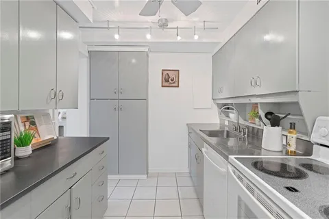 a kitchen with a sink and refrigerator
