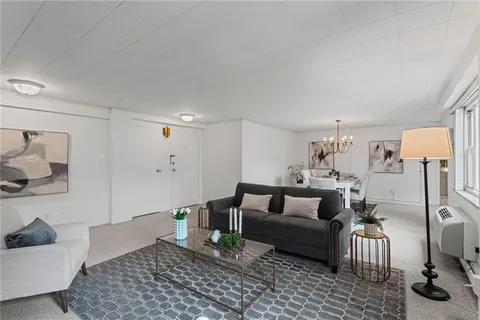 a living room with furniture and a couch