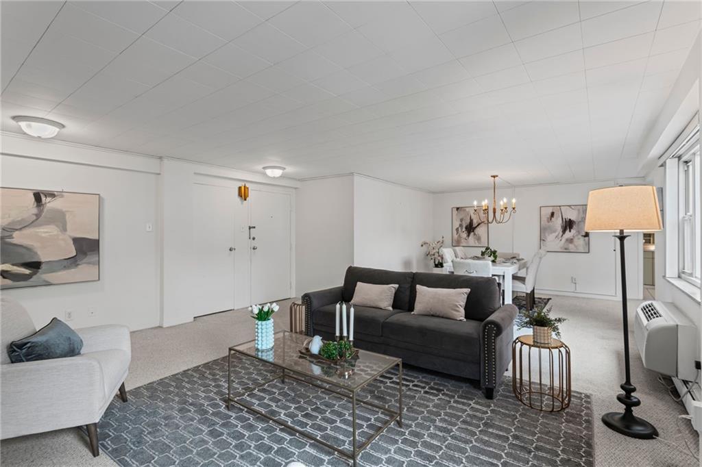 4601 Fifth Avenue, Unit 226 Pittsburgh, PA 15213 - Photo 2 of 34 a living room with furniture and a couch