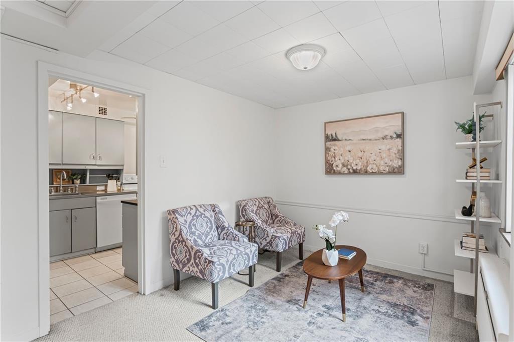 4601 Fifth Avenue, Unit 226 Pittsburgh, PA 15213 - Photo 10 of 34 a living room with furniture and kitchen view
