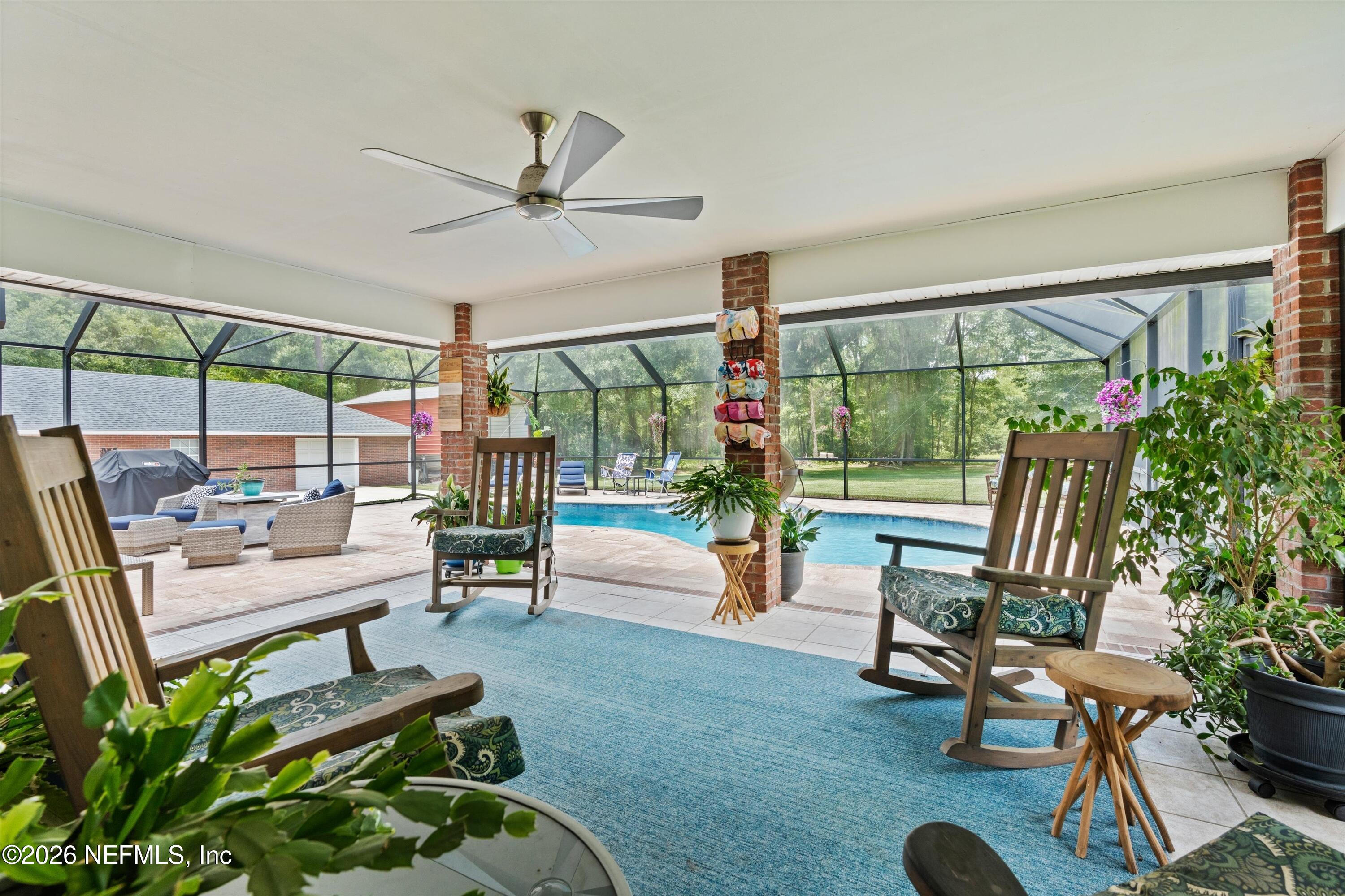 5566 Don Manuel Road Elkton, FL 32033 - Photo 34 of 47 a living room with patio furniture and a potted plant