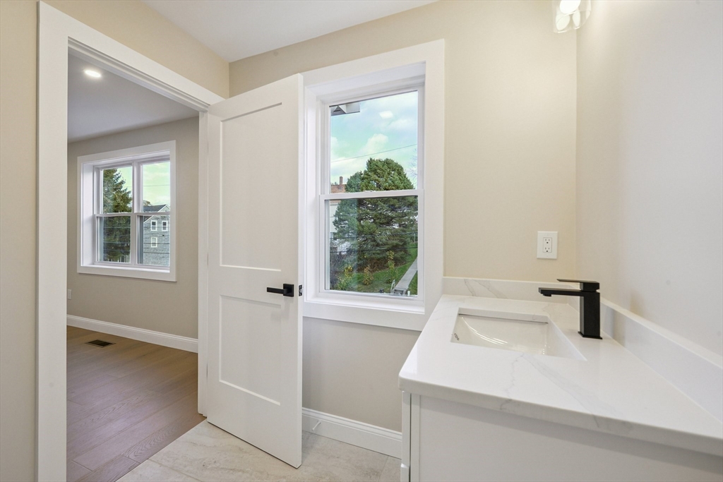 122 Stowe Street, Unit 122 Fall River, MA 02720 - Photo 16 of 21 a bathroom with a sink and a window