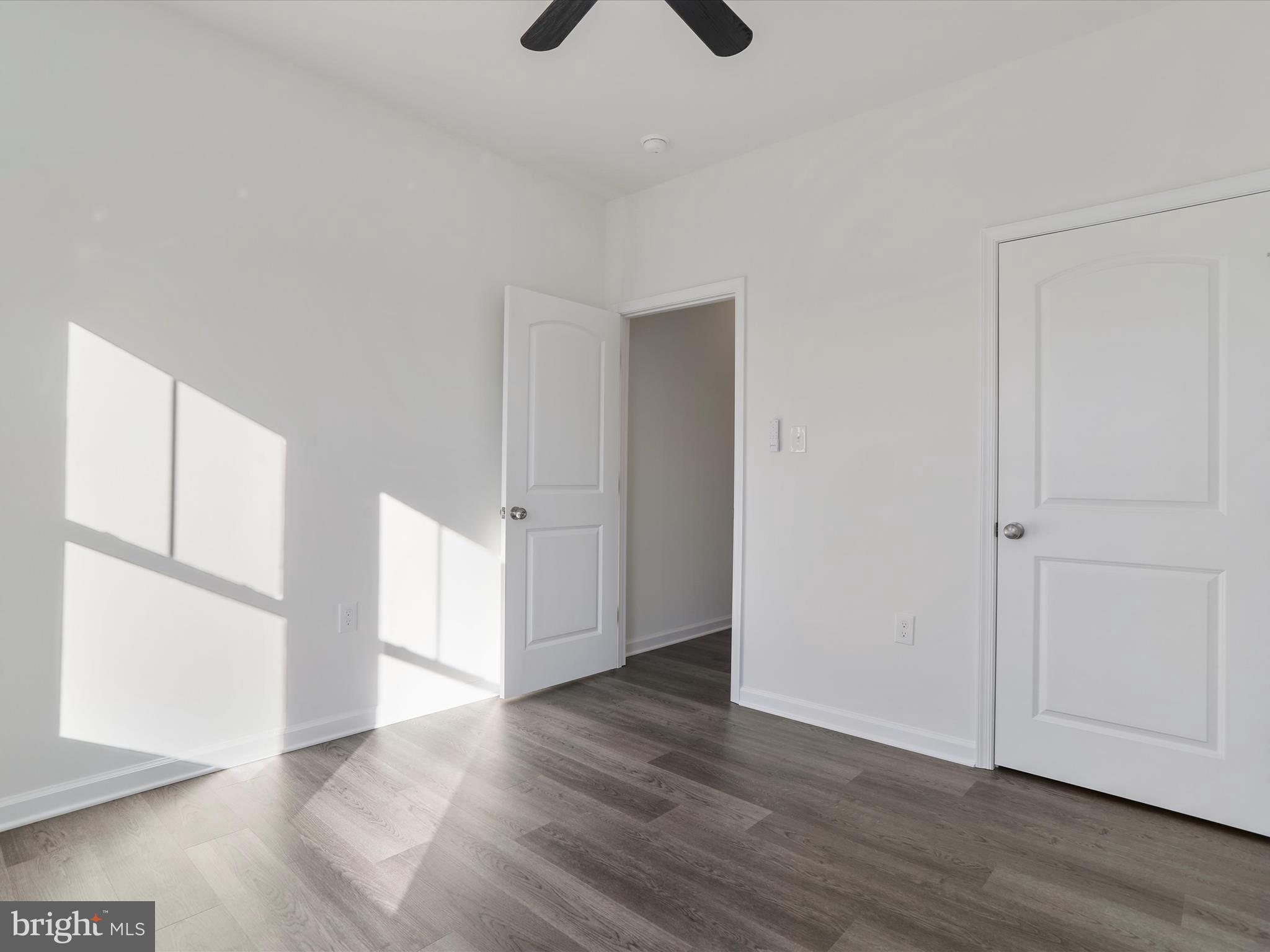 117 East 7th Avenue Ranson, WV 25438 - Photo 24 of 29 a view of an empty room with wooden floor
