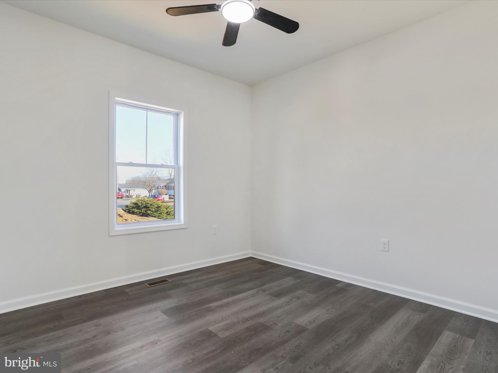 117 East 7th Avenue Ranson, WV 25438 - Photo 25 of 29 an empty room with a window and ceiling fan