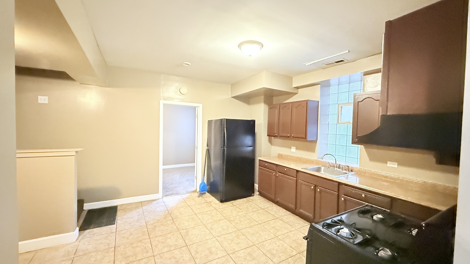 8017 South Phillips Avenue, Unit G Chicago, IL 60617 - Photo 12 of 16 a kitchen with stainless steel appliances granite countertop a refrigerator and a sink