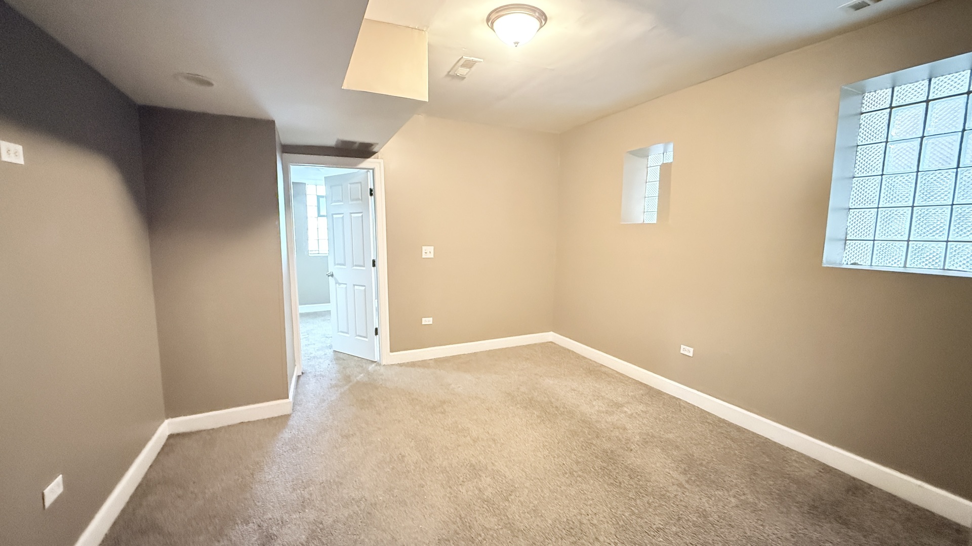 8017 South Phillips Avenue, Unit G Chicago, IL 60617 - Photo 2 of 16 an empty room with windows and closet