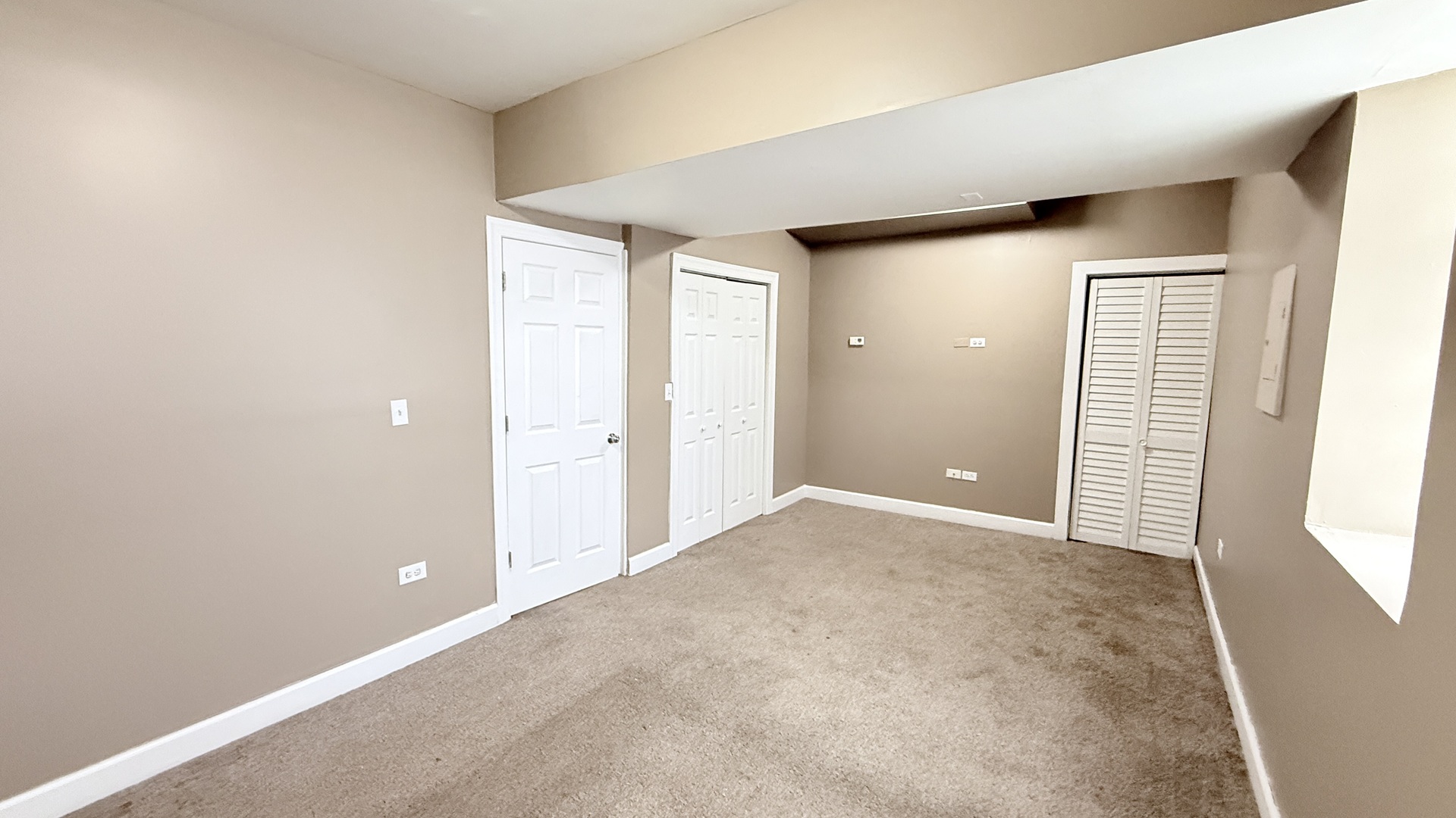 8017 South Phillips Avenue, Unit G Chicago, IL 60617 - Photo 5 of 16 an empty room with windows and closet