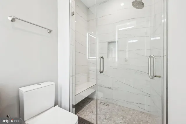 a bedroom with a large bed and a couch