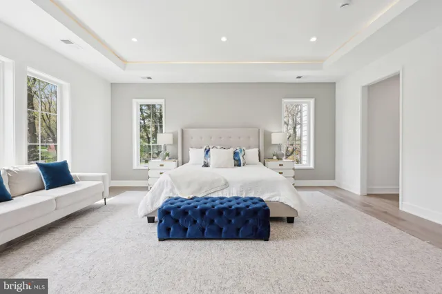 a spacious bathroom with a bathtub and next to a window